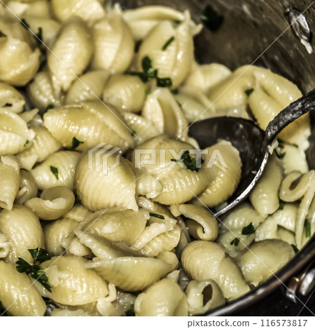 Cooking pasta in a pan Cooking pasta in a pan 116573817