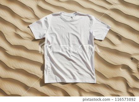 White t-shirt on sand texture. Cotton tshirt in nature coastline background. Mockup blank fashion desert design. Casual blank shirt textile. Empty mock up cloth collection 116573892