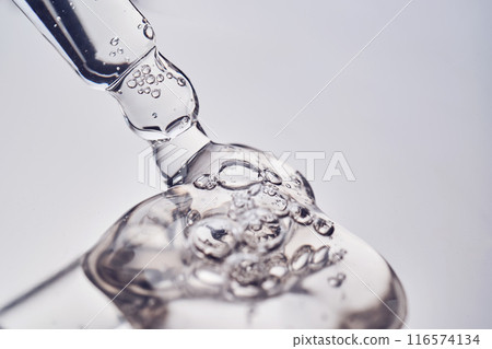 Pipette with cosmetic gel or serum close-up. 116574134