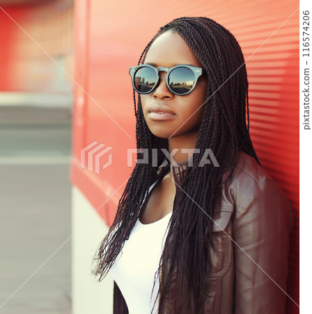 Fashionable young African woman in casual clothing, stylish modern black girl posing in the city Fashionable young African woman in casual clothing, stylish modern black girl posing in the city 116574206