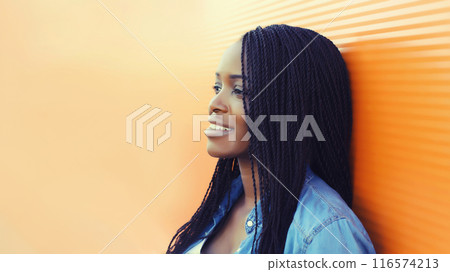 Portrait of happy smiling young african woman with dreadlocks, black girl looking away in the city Portrait of happy smiling young african woman with dreadlocks, black girl looking away in the city 116574213