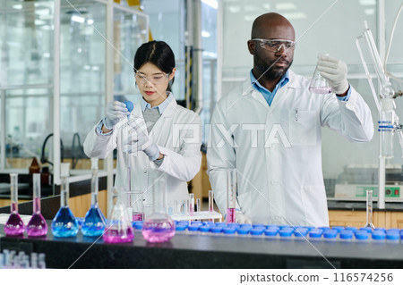 Studying liquid substance in glassware Studying liquid substance in glassware 116574256