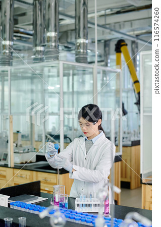 Young female researcher in laboratory Young female researcher in laboratory 116574260