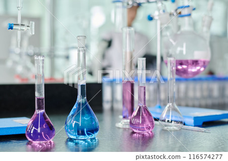 Group of transparent glassware on table 116574277