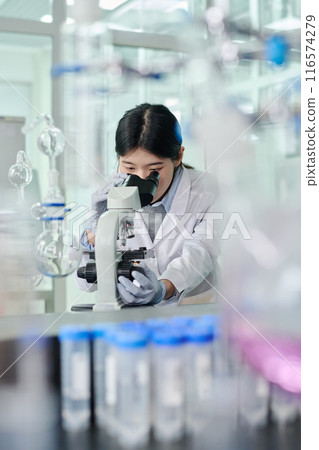 Woman studying new chemical substance Woman studying new chemical substance 116574279