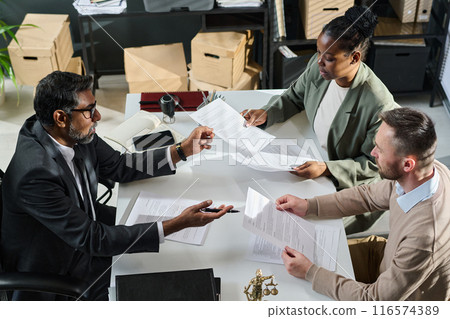 Jurist passing and taking documents 116574389
