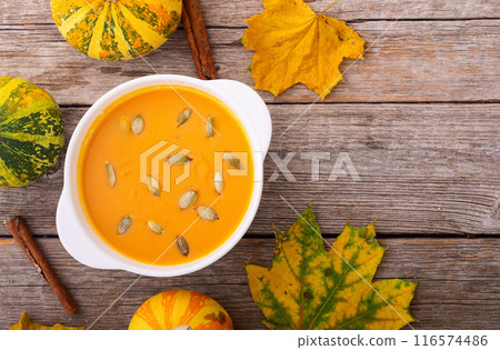 Healthy vegetarian autumn pumpkin soup . Diet food background . 116574486
