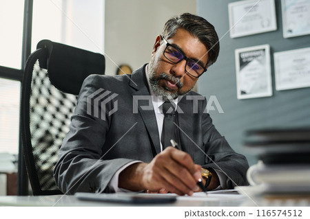 Reading contract before signing it Reading contract before signing it 116574512