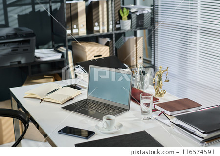 Laptop with blank screen on desk 116574591