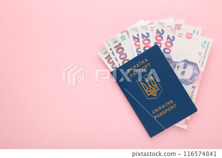 Ukrainian passport and money. Biometric passport of a citizen of Ukraine and 200 banknote. Ukrainian passport and money. Biometric passport of a citizen of Ukraine and 200 banknote. 116574841