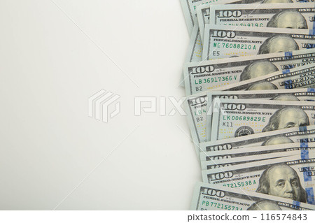 A pile of hundred dollar bills on white background with copy space 116574843