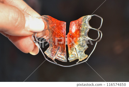 Red Retainer on a white background.Already used And is closely imaged. Red Retainer on a white background.Already used And is closely imaged. 116574850