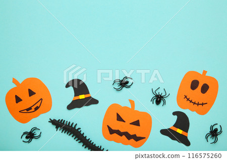 Halloween composition with pumpkin and spiders on blue background. View from above 116575260
