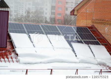 Solar panels covered by snow 116575323
