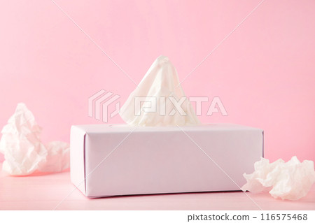Box with paper tissues and used crumpled napkins on pink background Box with paper tissues and used crumpled napkins on pink background 116575468