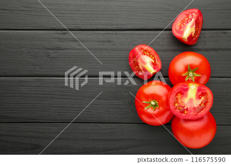 Red tomatoes on black wooden background. Top view 116575590