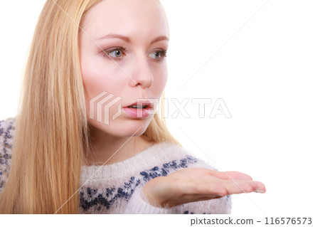 Blonde womn sending air kiss on palm hand Blonde womn sending air kiss on palm hand 116576573