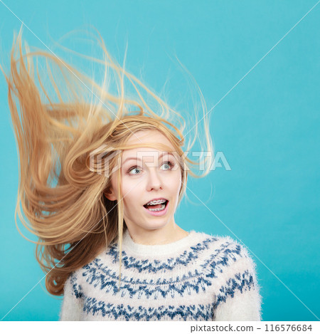 Crazy blonde woman with windblown blonde hair 116576684