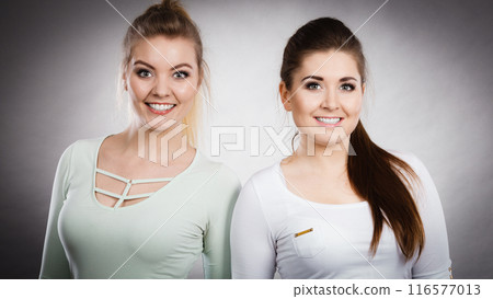 Two happy women friends having fun Two happy women friends having fun 116577013