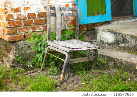 An old chair in an abandoned house 116577630