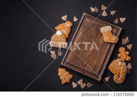 Empty wooden cutting board with Christmas decor elements Empty wooden cutting board with Christmas decor elements 116578009