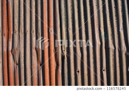 Rusty corrugated tin roof 116578245