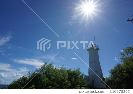 White lighthouse and blue sky White lighthouse and blue sky 116578265