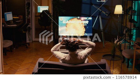 Gamer receiving game over screen, getting his spaceship destroyed in huge explosion while fliying in galaxy and fighting enemies. Player losing science fiction spacecraft singleplayer videogame 116578914