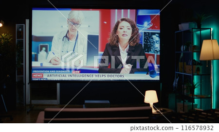 Smart TV in empty living room displaying breaking news coverage with anchorwoman talking about medical AI uses, zoom in shot. Big television display showing streaming channel for cord cutters Smart TV in empty living room displaying breaking news coverage with anchorwoman talking about medical AI uses, zoom in shot. Big television display showing streaming channel for cord cutters 116578932