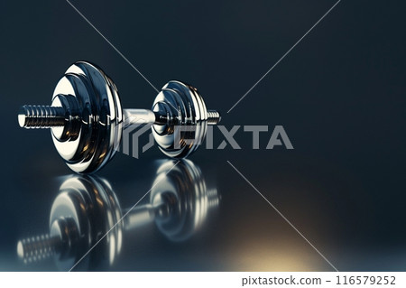Metallic dumbbells resting on a reflective surface with copy space 116579252