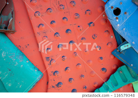 Multicolored red plastic metal waste abstract 116579348