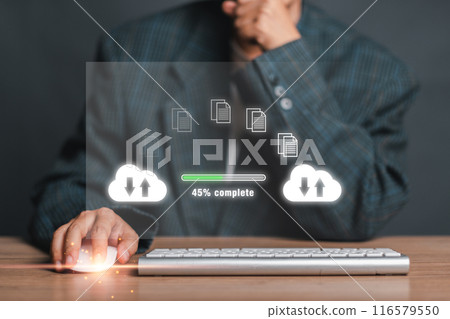 A businessman using a keyboard to initiate a file transfer with cloud computing icons and a progress bar, symbolizing data transfer and digital communication. A businessman using a keyboard to initiate a file transfer with cloud computing icons and a progress bar, symbolizing data transfer and digital communication. 116579550