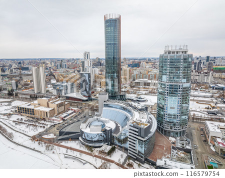 Yekaterinburg city with Buildings of Regional Government and Parliament, Dramatic Theatre, Iset Tower, Yeltsin Center, panoramic view at winter sunset. 116579754