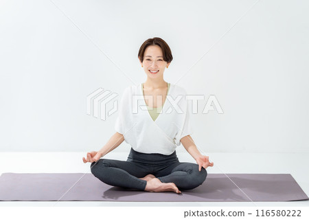 A woman doing yoga 116580222