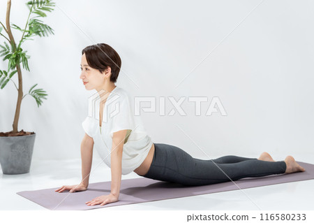 A woman doing yoga A woman doing yoga 116580233