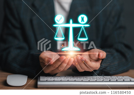 A businessman holds a digital scale of justice, symbolizing ethics, fairness, and integrity in business practices. Ideal for concepts related to law, justice, and corporate ethics. 116580450