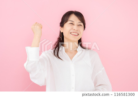Portrait of a woman in her 50s, fist pump Portrait of a woman in her 50s, fist pump 116581300