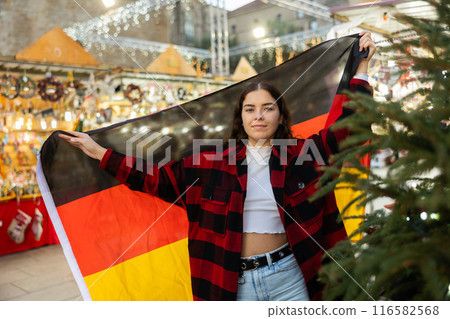 Girl with Germany flag at new year street fair 116582568