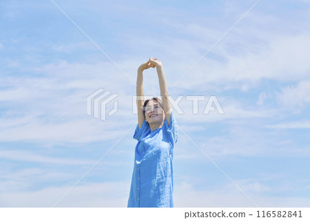 A woman stretching outdoors 116582841
