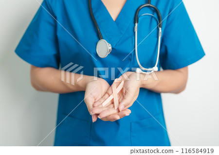 Doctor holding Peach Ribbon for September Uterine Cancer Awareness month. Uterus and Ovaries, Endometriosis, Hysterectomy, Uterine fibroids, Reproductive, Healthcare and World cancer day concept 116584919