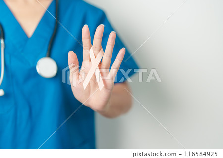 Doctor holding Peach Ribbon for September Uterine Cancer Awareness month. Uterus and Ovaries, Endometriosis, Hysterectomy, Uterine fibroids, Reproductive, Healthcare and World cancer day concept 116584925