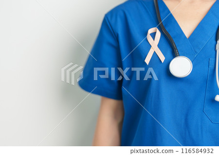 Doctor holding Peach Ribbon for September Uterine Cancer Awareness month. Uterus and Ovaries, Endometriosis, Hysterectomy, Uterine fibroids, Reproductive, Healthcare and World cancer day concept 116584932