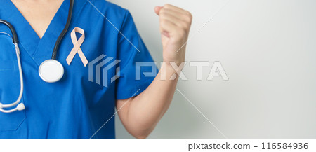 Doctor holding Peach Ribbon for September Uterine Cancer Awareness month. Uterus and Ovaries, Endometriosis, Hysterectomy, Uterine fibroids, Reproductive, Healthcare and World cancer day concept Doctor holding Peach Ribbon for September Uterine Cancer Awareness month. Uterus and Ovaries, Endometriosis, Hysterectomy, Uterine fibroids, Reproductive, Healthcare and World cancer day concept 116584936