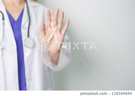 Doctor holding Peach Ribbon for September Uterine Cancer Awareness month. Uterus and Ovaries, Endometriosis, Hysterectomy, Uterine fibroids, Reproductive, Healthcare and World cancer day concept Doctor holding Peach Ribbon for September Uterine Cancer Awareness month. Uterus and Ovaries, Endometriosis, Hysterectomy, Uterine fibroids, Reproductive, Healthcare and World cancer day concept 116584944
