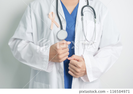 Doctor holding Peach Ribbon for September Uterine Cancer Awareness month. Uterus and Ovaries, Endometriosis, Hysterectomy, Uterine fibroids, Reproductive, Healthcare and World cancer day concept 116584971