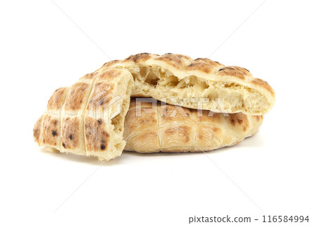 Pita flat-bread toasted of a grid pattern over white Pita flat-bread toasted of a grid pattern over white 116584994