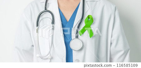Doctor with green Ribbon for world Lymphoma Awareness September month, world Mental Health Day, Liver, Gallbladders, bile duct, cervical, kidney Cancer. Healthcare and world cancer day concept 116585109