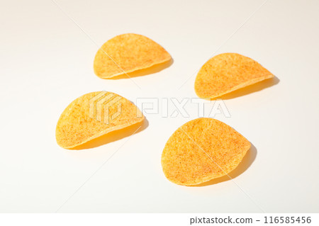 Crispy potato chips on a light background 116585456