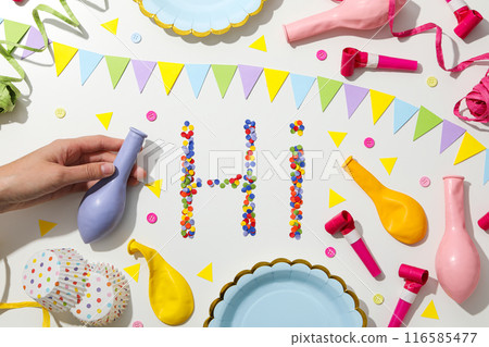 The word "hi" is made of colored plasticine on a white background. 116585477