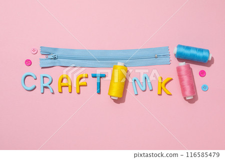 The word "craft" is made of colored plasticine, laid out on a pink background. 116585479
